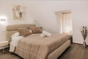 a bedroom with a large bed in a room at NICOLAUS SUITE Wellness Experience in Bari Palese