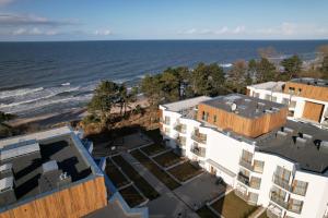 an aerial view of the beach and buildings at Let's Sea by 2HomeRent in Gąski