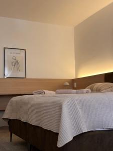 Posteľ alebo postele v izbe v ubytovaní Apartmány Reduta - new