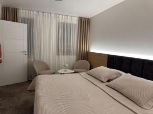 Posteľ alebo postele v izbe v ubytovaní Apartmány Reduta - new