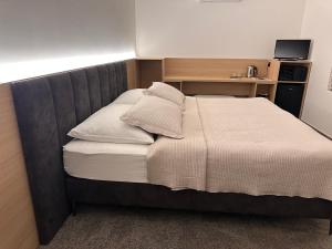 Posteľ alebo postele v izbe v ubytovaní Apartmány Reduta - new