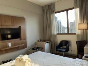 Cama ou camas em um quarto em Hotel Vivenzo Savassi Belo Horizonte