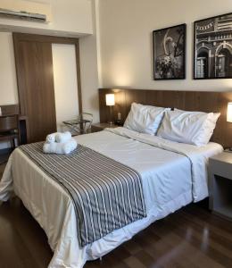Cama ou camas em um quarto em Hotel Vivenzo Savassi Belo Horizonte