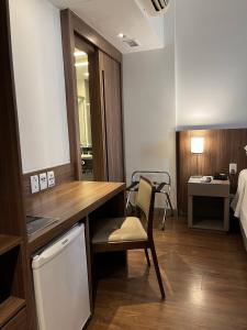 Cama ou camas em um quarto em Hotel Vivenzo Savassi Belo Horizonte