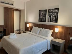 Cama ou camas em um quarto em Hotel Vivenzo Savassi Belo Horizonte