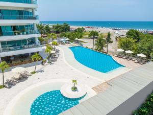 an aerial view of a resort swimming pool and the beach at Sonesta Hotel Cartagena in Cartagena de Indias