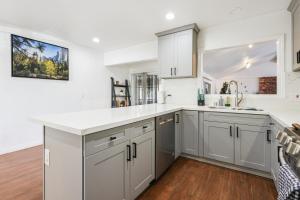 a kitchen with white cabinets and a counter top at Spacious Family Retreat in the heart of San Diego in San Diego