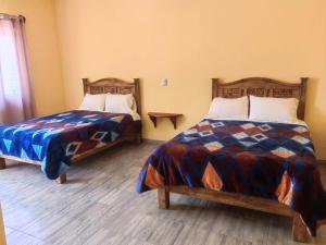 Postel nebo postele na pokoji v ubytování Hotel Villa Aurora