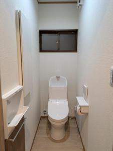 a small bathroom with a toilet and a sink at お宿みとしる in Mito +18 photos
