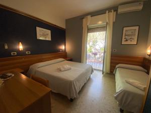 Postel nebo postele na pokoji v ubytování Hotel Praja Mare