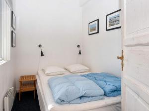 Postel nebo postele na pokoji v ubytování 10 person holiday home in Harboøre-By Traum