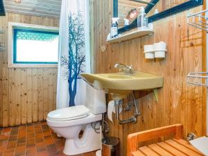 a bathroom with a sink and a toilet at 7 person holiday home in Lemvig-By Traum in Lemvig +23 photos