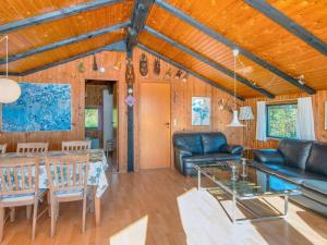 a living room with a couch and a table at 7 person holiday home in Lemvig-By Traum in Lemvig