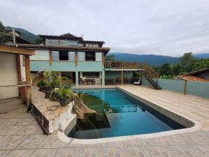 Πισίνα στο ή κοντά στο Casa Rústica Ilhabela