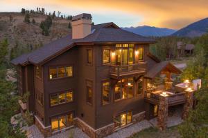 an aerial view of a house with a mountain at 671 Elk Circle by Summit County Mountain Retreats in Keystone