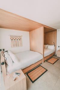 Postel nebo postele na pokoji v ubytování AKEN MIND Mérida Hotel + 37 fotografií