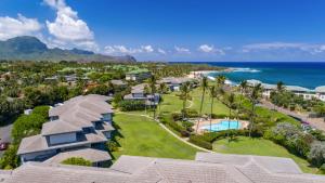 an aerial view of a resort with the ocean at Poipu Sands 214 in Koloa