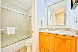 a bathroom with a shower and a sink and a toilet at Condo in Newport Beach with Private Balcony and Ideal Location by the Pier in Newport Beach +11 photos