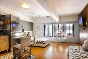 a large living room with a bed and a table at iDesign Loft at Old San Juan in San Juan