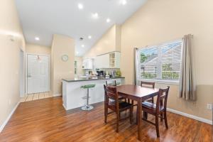 a kitchen and dining room with a table and chairs at Serenity Now in Branson