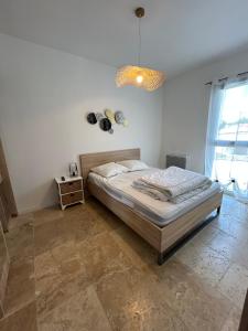 Łóżko lub łóżka w pokoju w obiekcie Appartement T3 dans maison neuve 7 couchages
