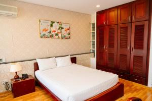Postel nebo postele na pokoji v ubytování Anh Dao Mekong Hotel