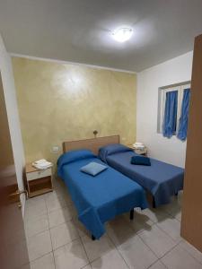 Кровать или кровати в номере Villa Angela case vacanza