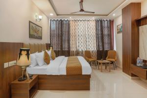 Postel nebo postele na pokoji v ubytování Hotel Devine Zirakpur Chandigarh