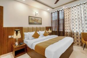 Postel nebo postele na pokoji v ubytování Hotel Devine Zirakpur Chandigarh