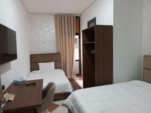 TV a/nebo společenská místnost v ubytování Hotel De Provence
