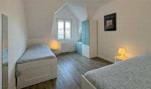 Postel nebo postele na pokoji v ubytování Appartement Quiberon