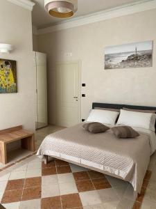 a bedroom with a large bed in a room at Easter Suite in Acquaviva delle Fonti
