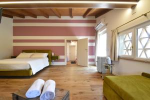Postel nebo postele na pokoji v ubytování Residenza Vesentini + 37 fotografií