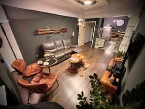an overhead view of a living room with a couch and a dog at Vintage Cozy Suite in Vodno