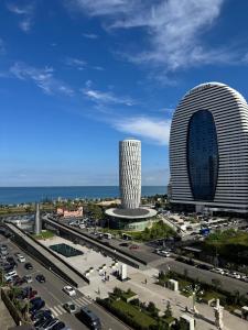 a view of a large building and a highway at EVIS LTD apartments Batumi 2 in Angisa
