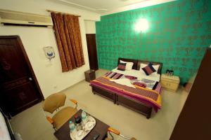 Postel nebo postele na pokoji v ubytování Hotel Smart Stay