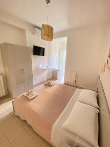 Postel nebo postele na pokoji v ubytování B&B degli Aranci