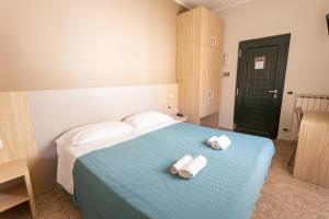 Postel nebo postele na pokoji v ubytování Hotel Tecla