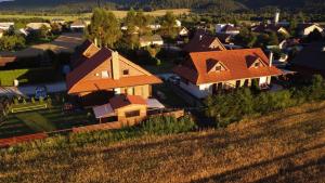 an overhead view of a house in a village at DREVENÝ APARTMÁN Slovenský raj Hrabušice in Hrabušice