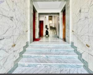 a hallway with stairs in a building at Mare e Relax Portosole in Sanremo