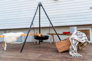 a fire swing on a porch with a fire at TROMSØ AURORA VILLA - Parking - Near Centrum in Tromsø