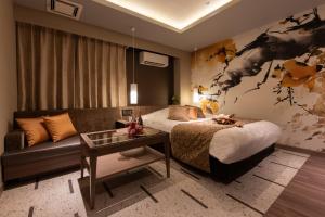 Postel nebo postele na pokoji v ubytování hotel AYA Adult Only