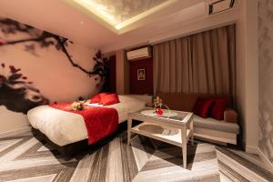 Postel nebo postele na pokoji v ubytování hotel AYA Adult Only