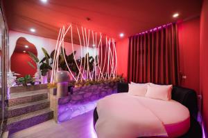 Postel nebo postele na pokoji v ubytování X Sense Love Hotel - Vinhomes Ocean Park 2
