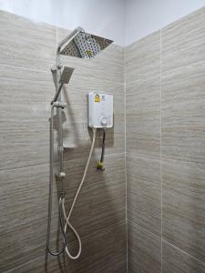 a shower with a shower head in a bathroom at เอเวอร์เมย์ รีสอร์ท Evermay Resort in Ban Plai Khlong +20 photos