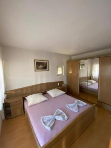 Postel nebo postele na pokoji v ubytování Mihaela Beach Apartments