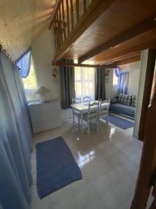 a living room with a table and a couch at Liget Villa Szentendre in Szentendre