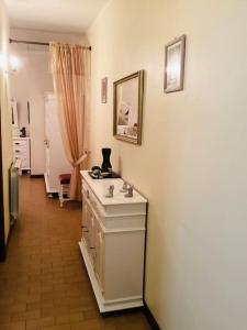 a room with a white room with a sink and a mirror at Casa Glória in Cabeceiras de Basto +15 photos