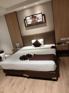 a bedroom with two beds in a room at ANNTILIA INN in Ludhiana +11 photos