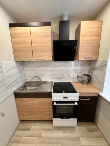 Kuchyň nebo kuchyňský kout v ubytování Tall61 Apartment